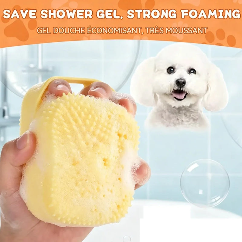 Yellow silicone pet bath brush with soft raised bristles in a hand for bathing